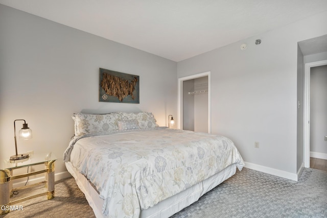 carpeted bedroom featuring a closet and baseboards