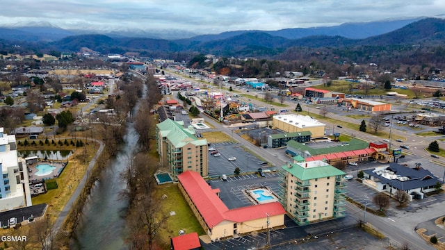 birds eye view of property with a mountain view