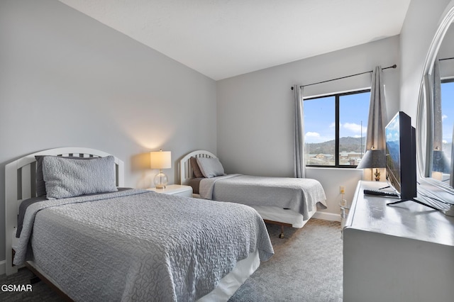 carpeted bedroom with baseboards