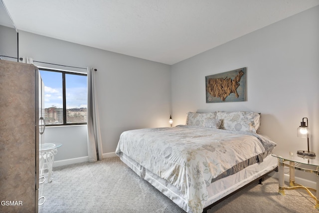 bedroom with carpet flooring and baseboards