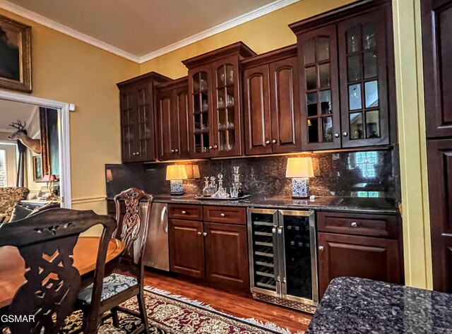 1042 Fine Glen Dr, Sevierville, TN 37862 - indoor bar featuring wine cooler, dark wood-style flooring, decorative backsplash, and ornamental molding