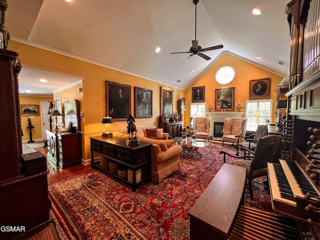 1042 Fine Glen Dr, Sevierville, TN 37862 - living area featuring a glass covered fireplace, ceiling fan, vaulted ceiling, wood finished floors, and recessed lighting