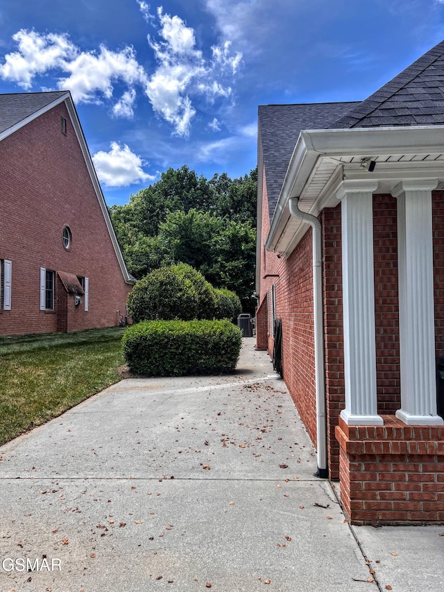 1042 Fine Glen Dr, Sevierville, TN 37862 - view of home's exterior with roof with shingles and brick siding