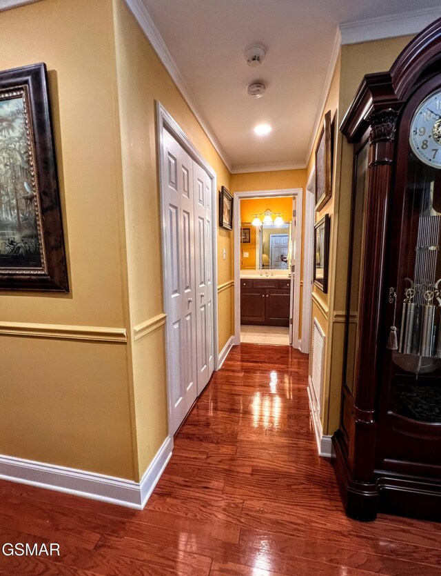 1042 Fine Glen Dr, Sevierville, TN 37862 - corridor with crown molding and dark wood finished floors
