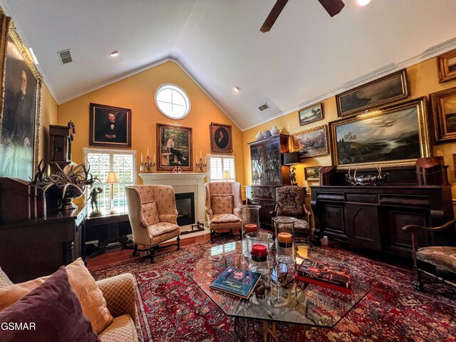 1042 Fine Glen Dr, Sevierville, TN 37862 - living room featuring ceiling fan, lofted ceiling, a glass covered fireplace, and plenty of natural light