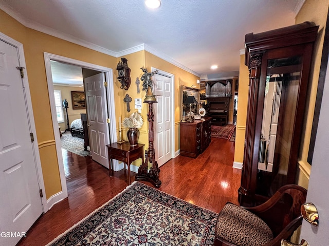 1042 Fine Glen Dr, Sevierville, TN 37862 - hall with dark wood-type flooring, ornamental molding, and recessed lighting