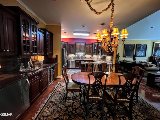 1042 Fine Glen Dr, Sevierville, TN 37862 - dining space featuring a chandelier, dark wood-style flooring, wine cooler, and crown molding