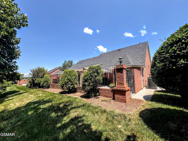 1042 Fine Glen Dr, Sevierville, TN 37862 - back of property with roof with shingles and brick siding