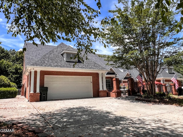1042 Fine Glen Dr, Sevierville, TN 37862 - view of front of home featuring driveway, brick siding, an attached garage, and a shingled roof
