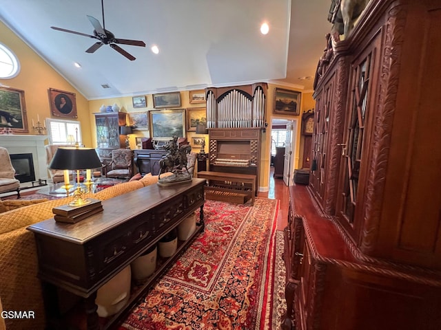 1042 Fine Glen Dr, Sevierville, TN 37862 - office space with a glass covered fireplace, ceiling fan, lofted ceiling, ornamental molding, and recessed lighting
