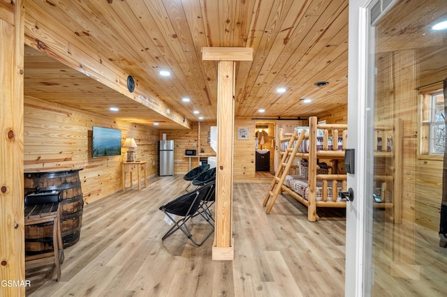 interior space featuring wooden walls, recessed lighting, wood finished floors, and wood ceiling