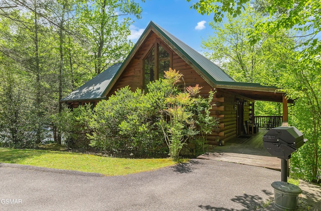 view of home's exterior with log siding