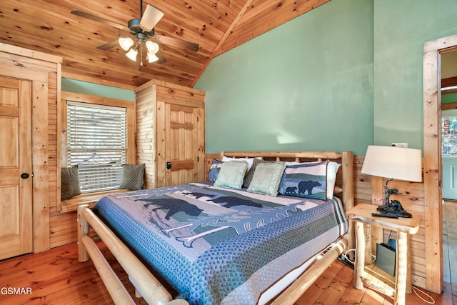 bedroom with lofted ceiling, wood ceiling, and hardwood / wood-style floors