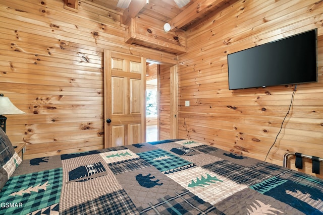 unfurnished bedroom featuring beam ceiling and wood walls