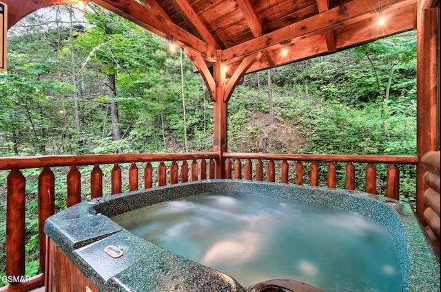 646 Gatlinburg Falls Way, Gatlinburg, TN 37738 - wooden deck featuring a hot tub and a forest view