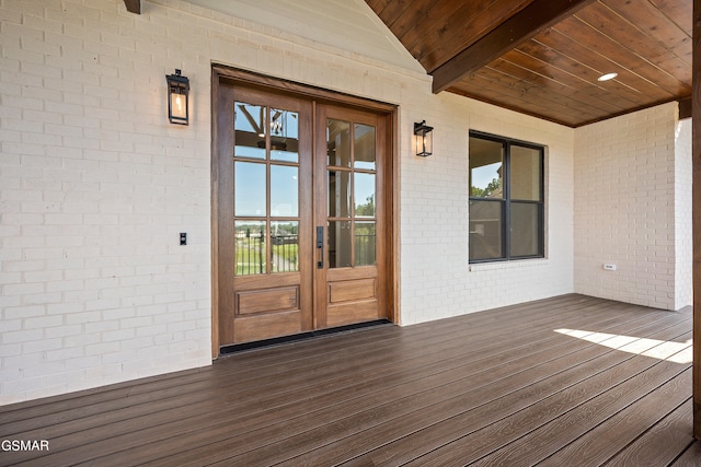 wooden deck featuring french doors