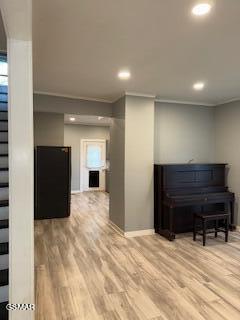 interior space featuring crown molding and hardwood / wood-style flooring