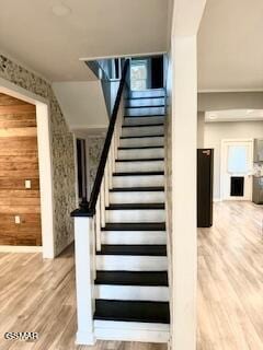 stairs with hardwood / wood-style floors