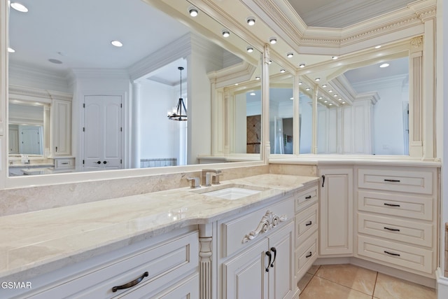 bathroom with tile patterned flooring, vanity, and ornamental molding