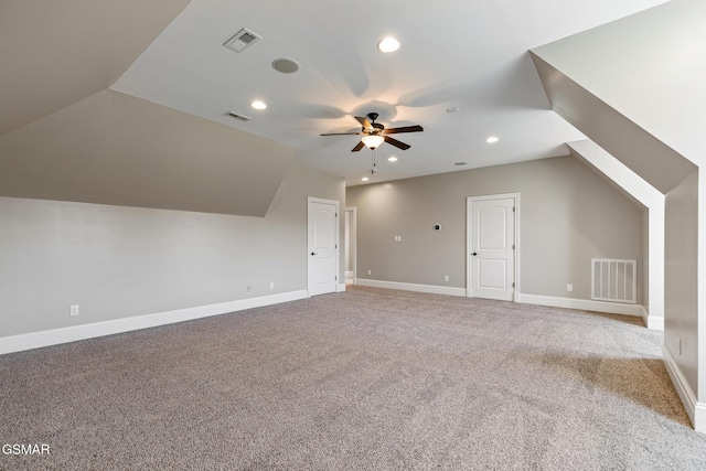 additional living space featuring visible vents, baseboards, and carpet floors