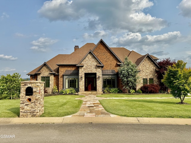1919 Legend View Ct, Sevierville, TN 37862 - craftsman house with stone siding, a front lawn, a chimney, and a shingled roof