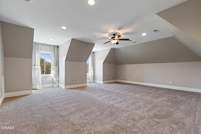 additional living space with a ceiling fan, baseboards, visible vents, carpet floors, and recessed lighting