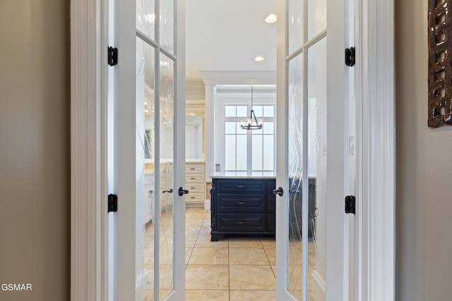 interior space with tile patterned floors, recessed lighting, and an inviting chandelier