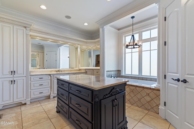 full bath with an inviting chandelier, ornamental molding, tile patterned flooring, and ornate columns