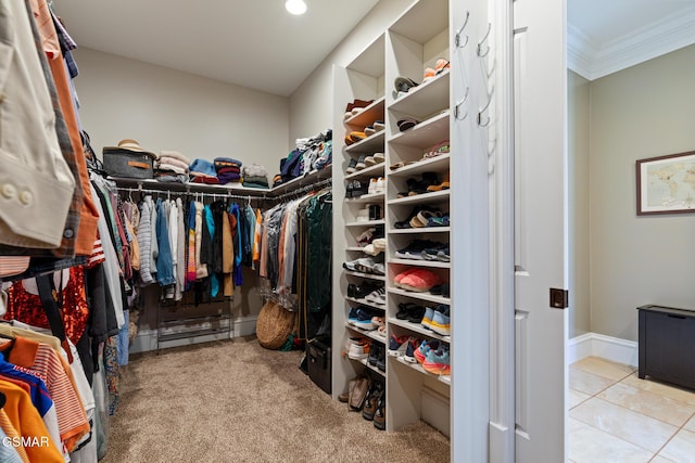 spacious closet featuring tile patterned floors and carpet floors