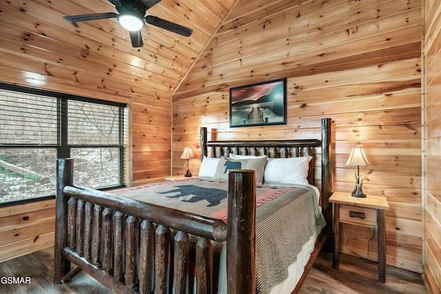 bedroom featuring lofted ceiling, ceiling fan, wooden walls, and hardwood / wood-style floors