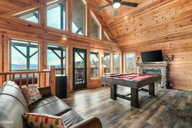 recreation room featuring wood ceiling, wood-type flooring, pool table, and a stone fireplace