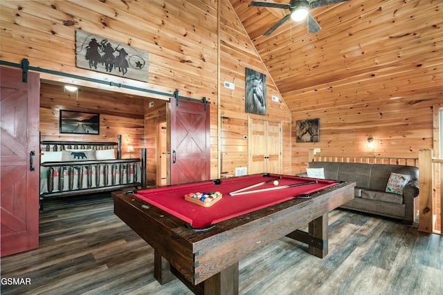 playroom with dark wood-type flooring, a barn door, billiards, and wooden walls