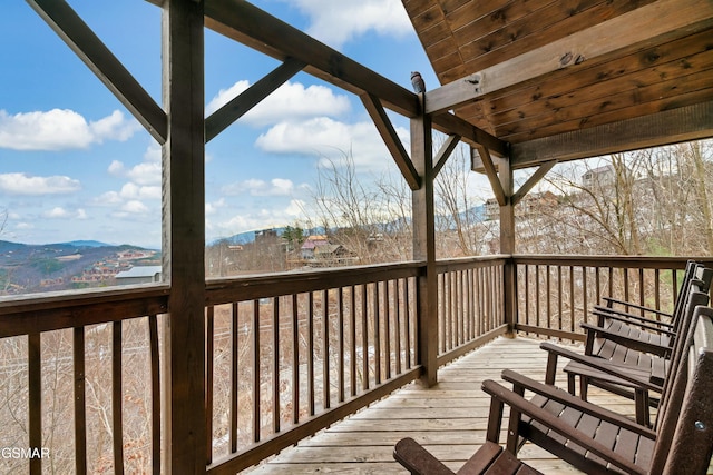 wooden terrace featuring a mountain view