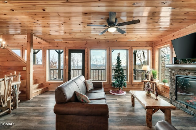 living room with ceiling fan, wooden ceiling, dark hardwood / wood-style flooring, and a fireplace