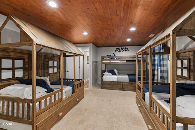 carpeted bedroom featuring wood ceiling