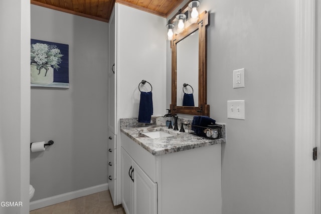 bathroom featuring vanity, tile patterned flooring, toilet, ornamental molding, and wood ceiling