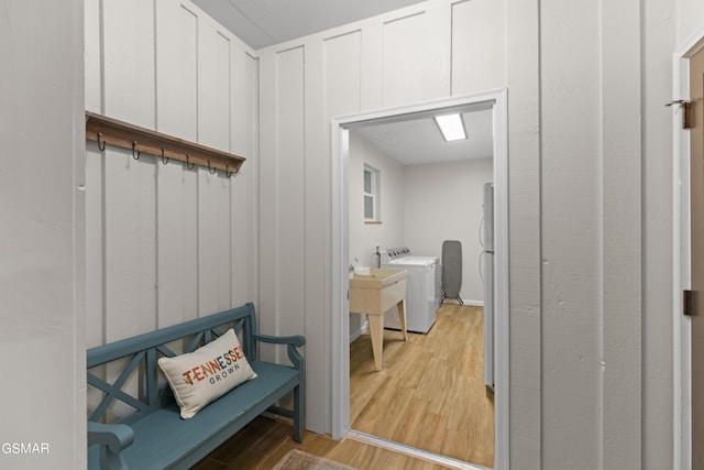 interior space featuring light wood-type flooring and washer / clothes dryer