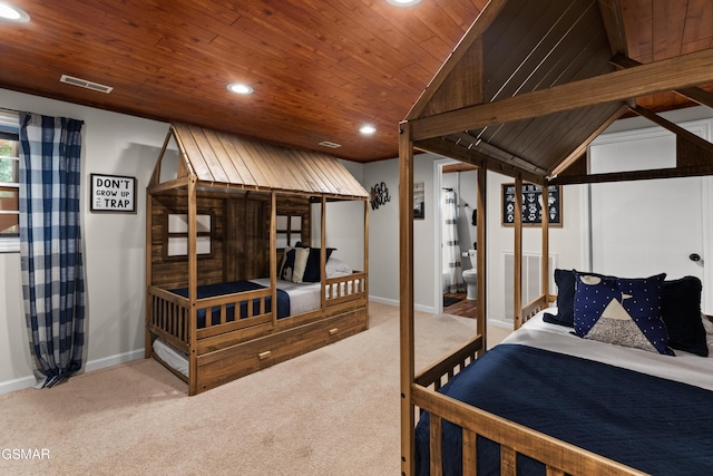 bedroom featuring connected bathroom, carpet, and wooden ceiling