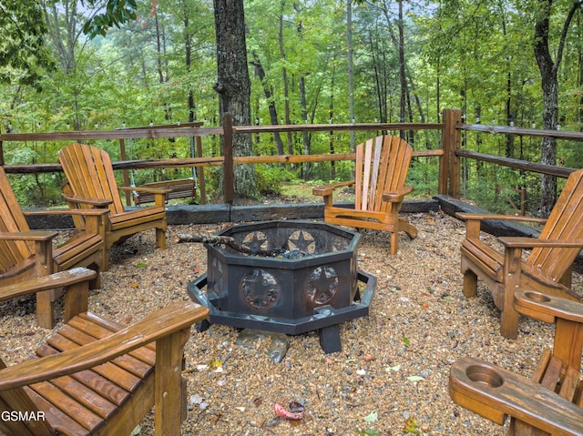 wooden deck with an outdoor fire pit