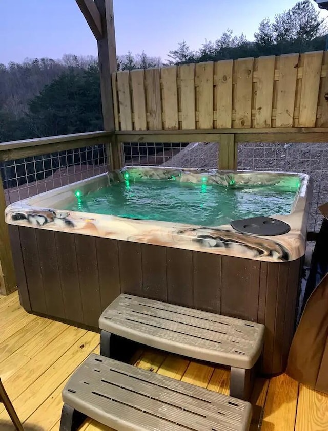 deck featuring a hot tub