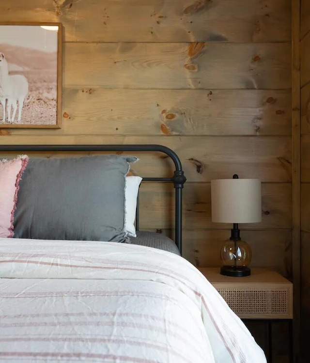 unfurnished bedroom featuring wooden walls