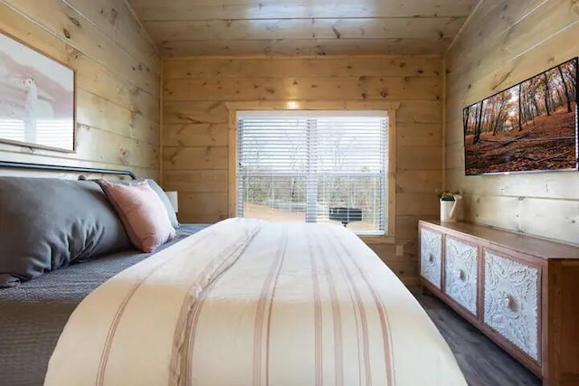 bedroom with wood walls, wooden ceiling, and lofted ceiling