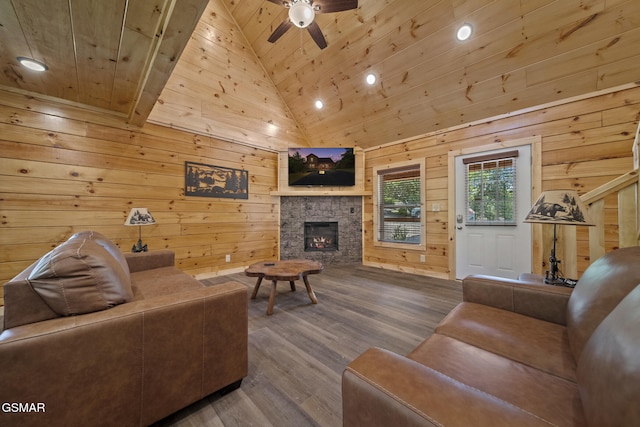 1515 Rainbow Ridge Way, Sevierville, TN 37862 - living area featuring a fireplace, wood ceiling, wood finished floors, wooden walls, and ceiling fan