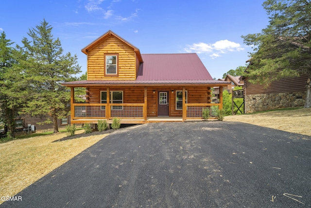 1515 Rainbow Ridge Way, Sevierville, TN 37862 - log home with a porch, a metal roof, and log siding