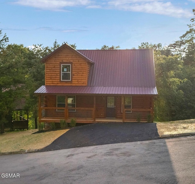 1515 Rainbow Ridge Way, Sevierville, TN 37862 - log cabin with covered porch, a metal roof, and driveway