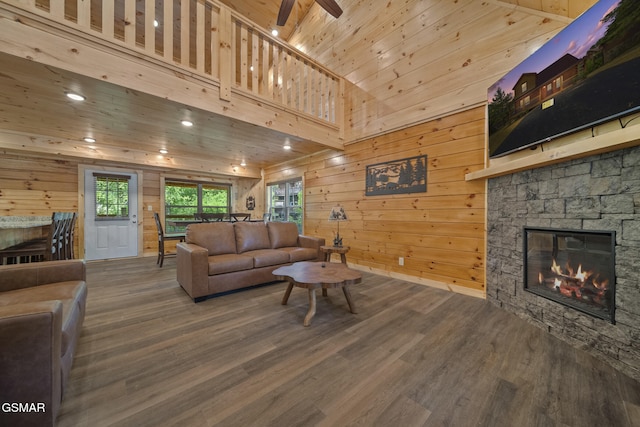 1515 Rainbow Ridge Way, Sevierville, TN 37862 - living area featuring a fireplace, wood finished floors, wood walls, wooden ceiling, and recessed lighting