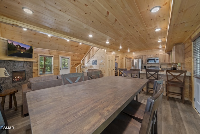 1515 Rainbow Ridge Way, Sevierville, TN 37862 - dining room featuring wood finished floors, wood ceiling, a stone fireplace, wooden walls, and recessed lighting