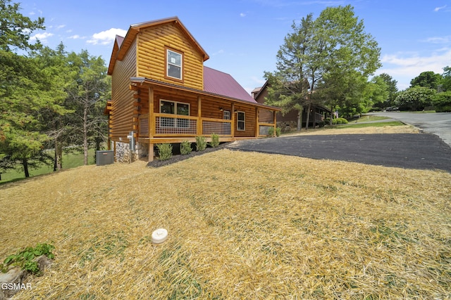 1515 Rainbow Ridge Way, Sevierville, TN 37862 - log home with a porch, a metal roof, and log exterior