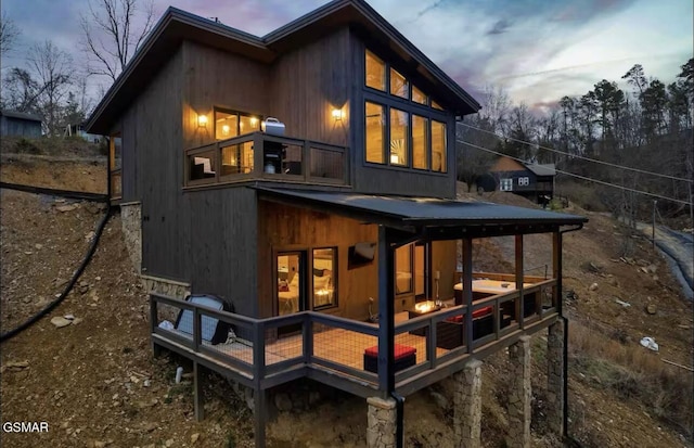 view of back of house at dusk