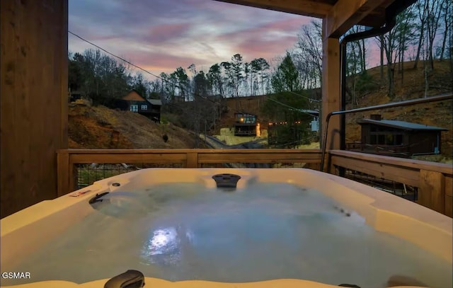 exterior space with a deck and a hot tub